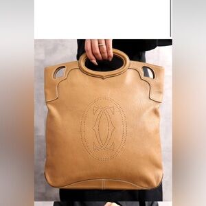 Pre-loved authentic Cartier Marcello Leather Tote  with perforated logo design.